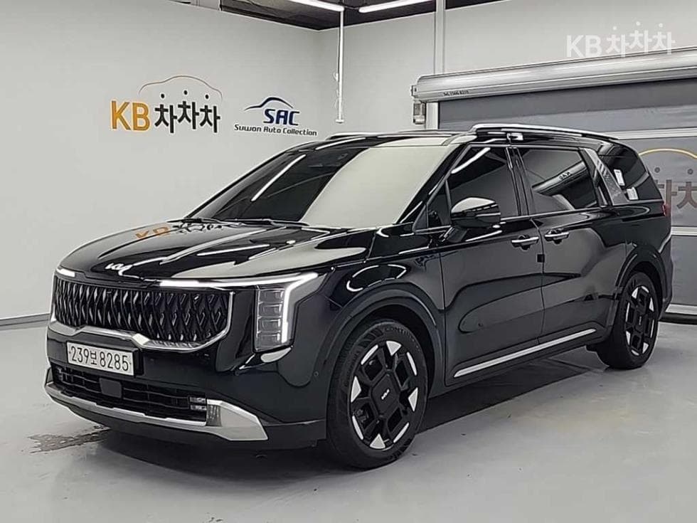 Киа The New (фейслифт) Канивал Хибрид 4-то поколение 1.6 HEV 9-местен Signature - Image 1